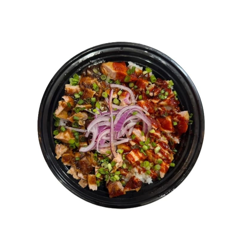 Chicken teriyaki and spicy chicken over rice, garnished with green onions and red onion slices.